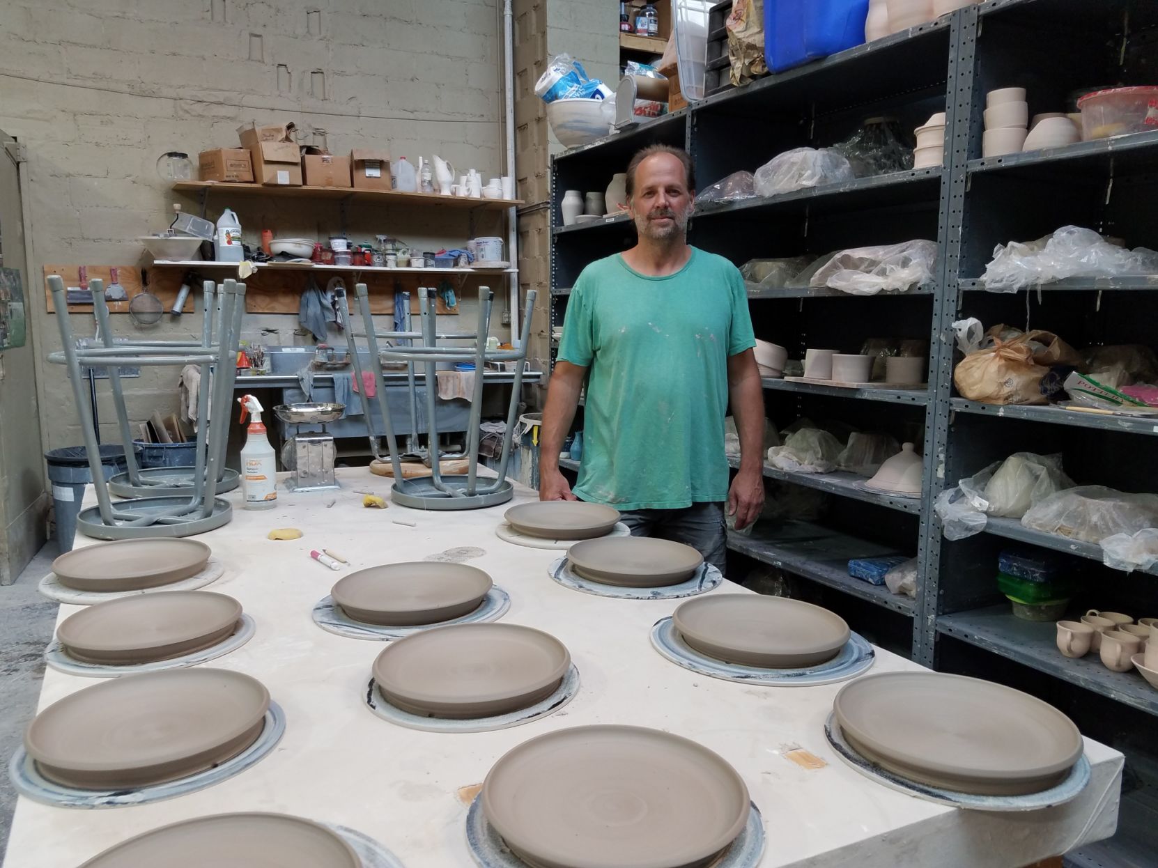 Chris Deprez at Fountain Square Clay Center with plates